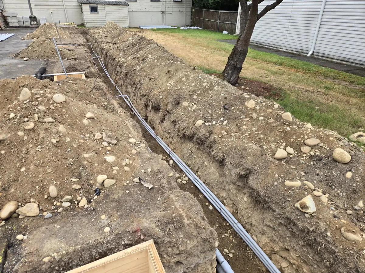 Multiple conduit runs laid in an open trench