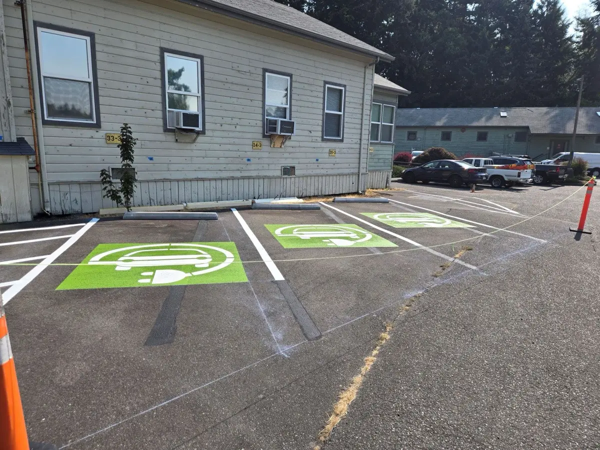 Freshly painted EV charging stalls with charging symbol markings