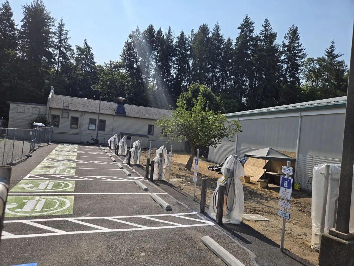 Row of EV charging stations installed along a fleet parking lot